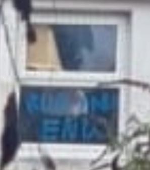 Rear window 1 of 20 College Street showing graffiti