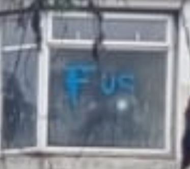 Rear window 2 of 20 College Street showing graffiti